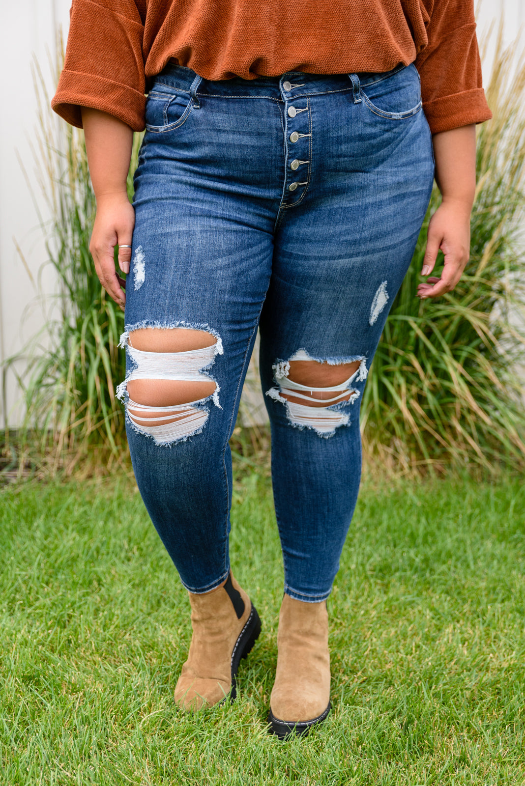 The Ari Hi-Rise Button Fly Cuffed Skinny jean is a must have denim staple! Hi-rise button fly and dark wash stretchy denim. Judy Blue Stretchy + Button fly + Distressed knees near me.