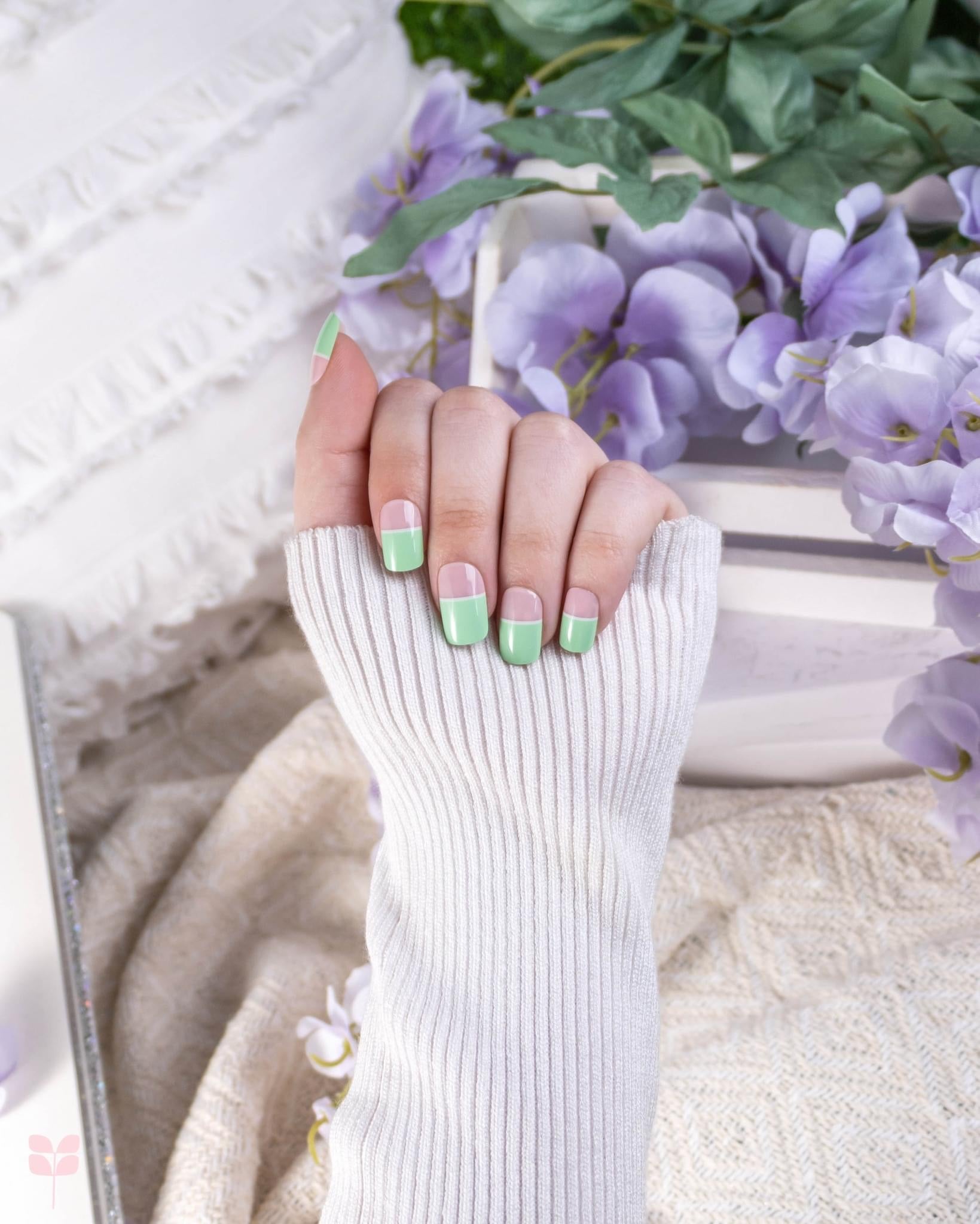 Manicured nails with light green tips